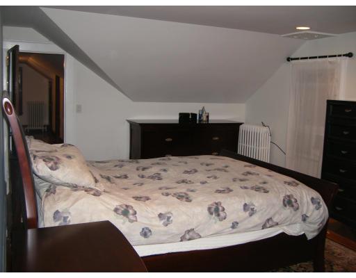 9 Hillside Road Newton, MA 02461 - Photo 8 of 9 a bedroom with a bed and mirror