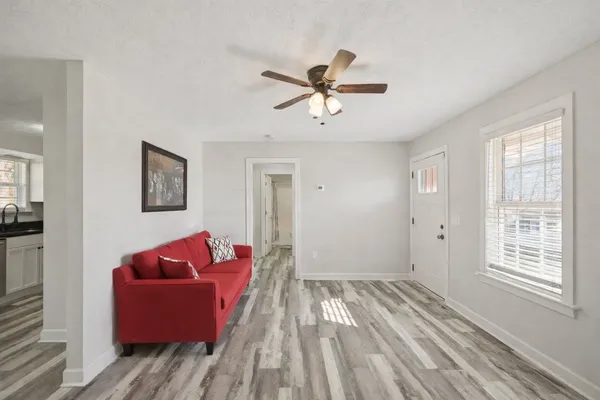 a living room with furniture and a window