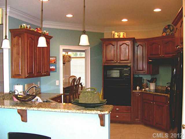 581 Mason Dickson Road York, SC 29745 - Photo 4 of 16 a kitchen with a refrigerator and a sink