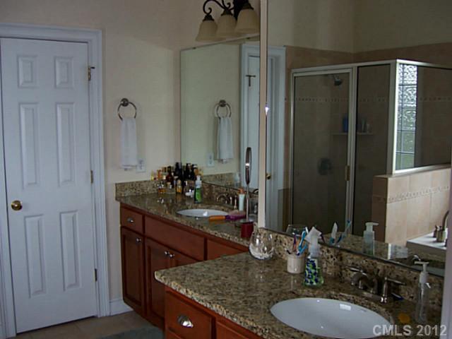 581 Mason Dickson Road York, SC 29745 - Photo 7 of 16 a bathroom with a granite countertop sink and a mirror