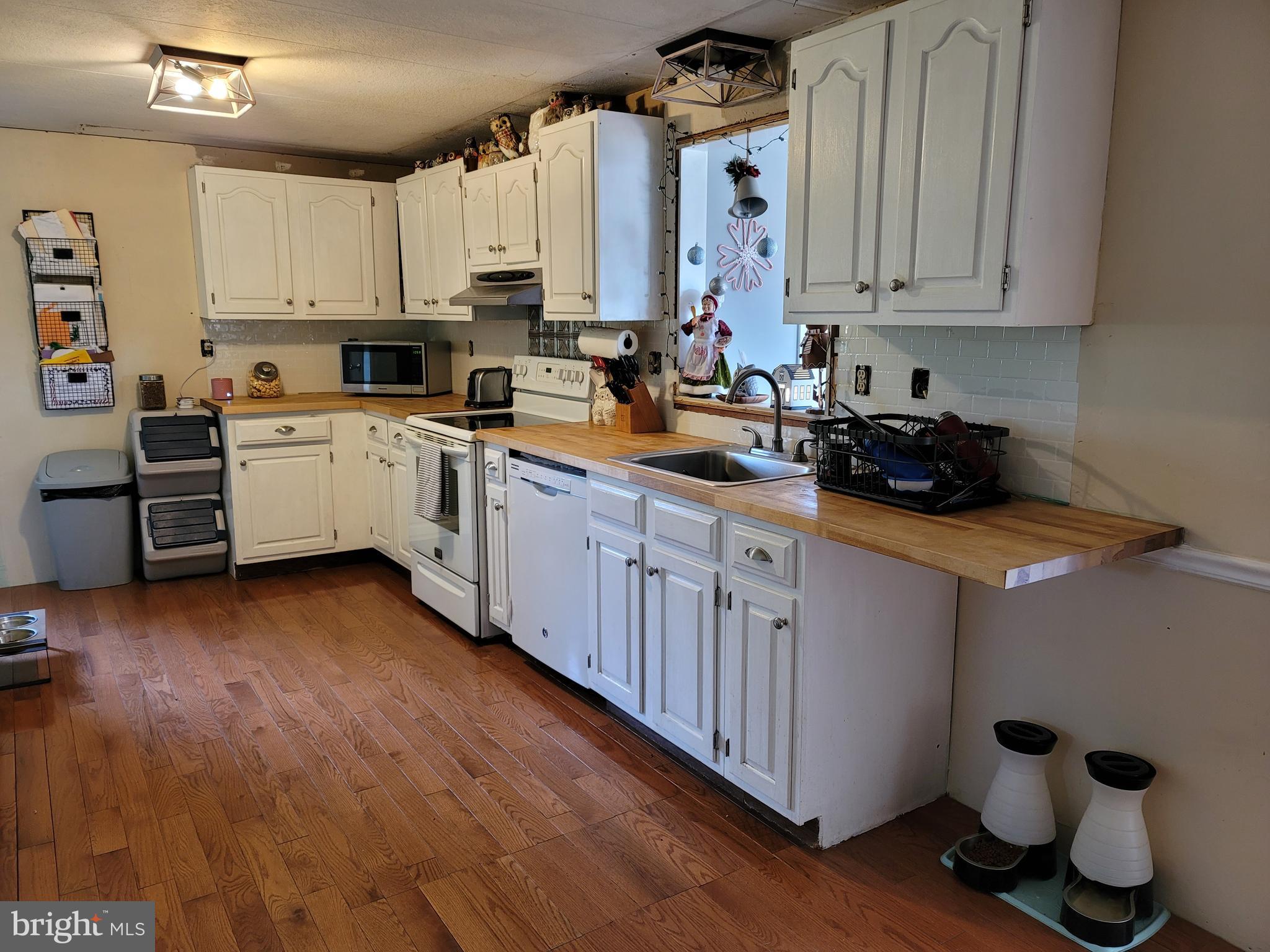 1349 Zook Road Atglen, PA 19310 - Photo 11 of 22 a kitchen with a sink a stove and cabinets