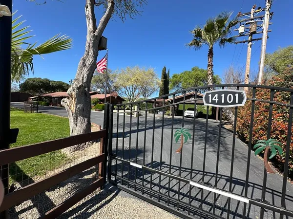 a view of a porch with chairs and backyard