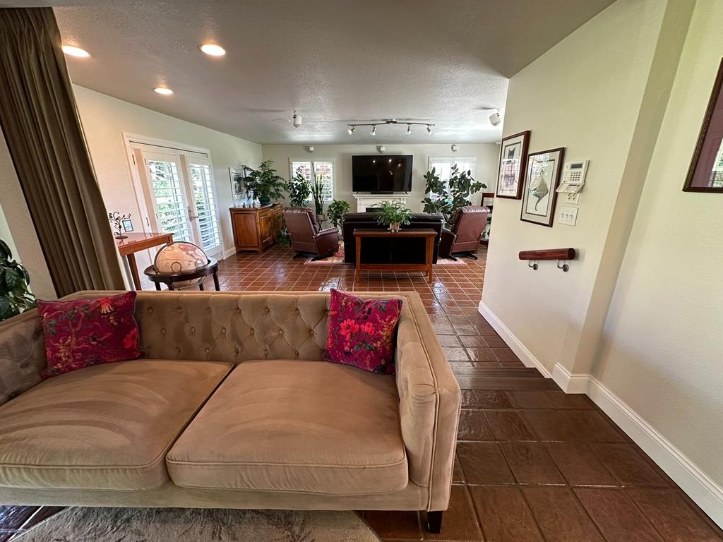 14101 Bethany Road Tracy, CA 95304 - Photo 21 of 68 a living room with furniture and a flat screen tv