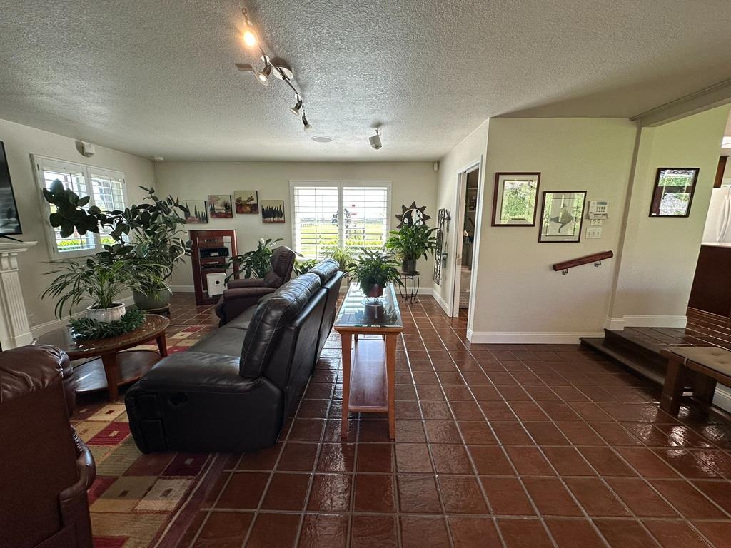 14101 Bethany Road Tracy, CA 95304 - Photo 23 of 68 a living room with furniture and a flat screen tv