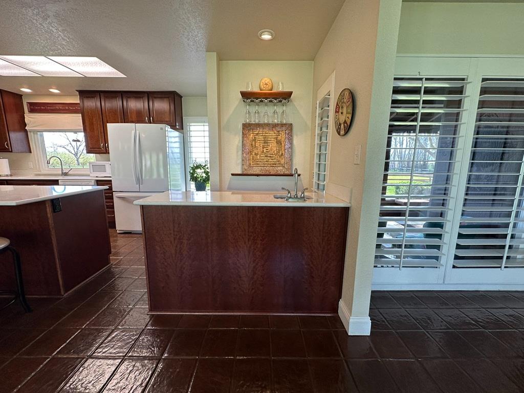 14101 Bethany Road Tracy, CA 95304 - Photo 28 of 68 a view of kitchen with cabinets and outdoor space