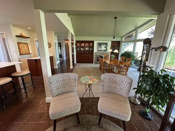 a view of a backyard with sitting area