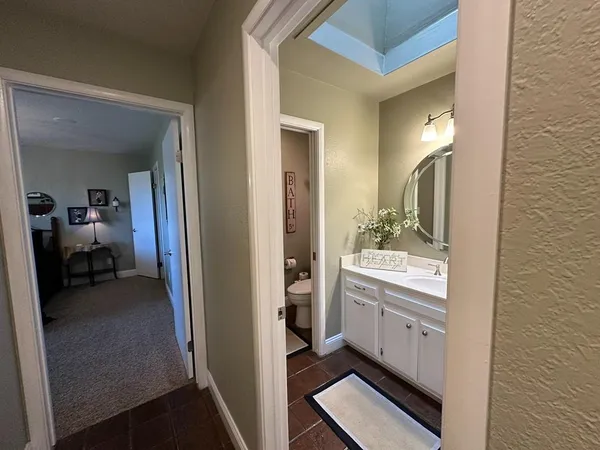 a view of a park with large trees