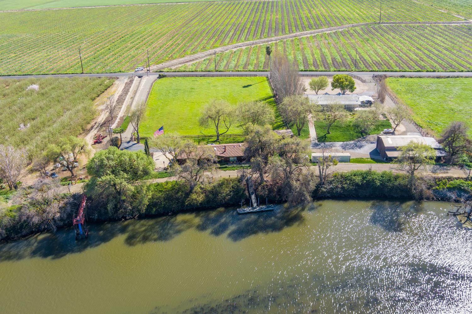 14101 Bethany Road Tracy, CA 95304 - Photo 5 of 68 a view of a lake with a building in the background
