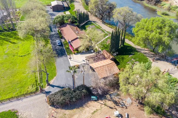 a view of a park with large trees