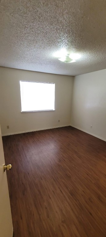 1142 Orchard Park Circle Pflugerville, TX 78660 - Photo 6 of 11 an empty room with wooden floor and windows