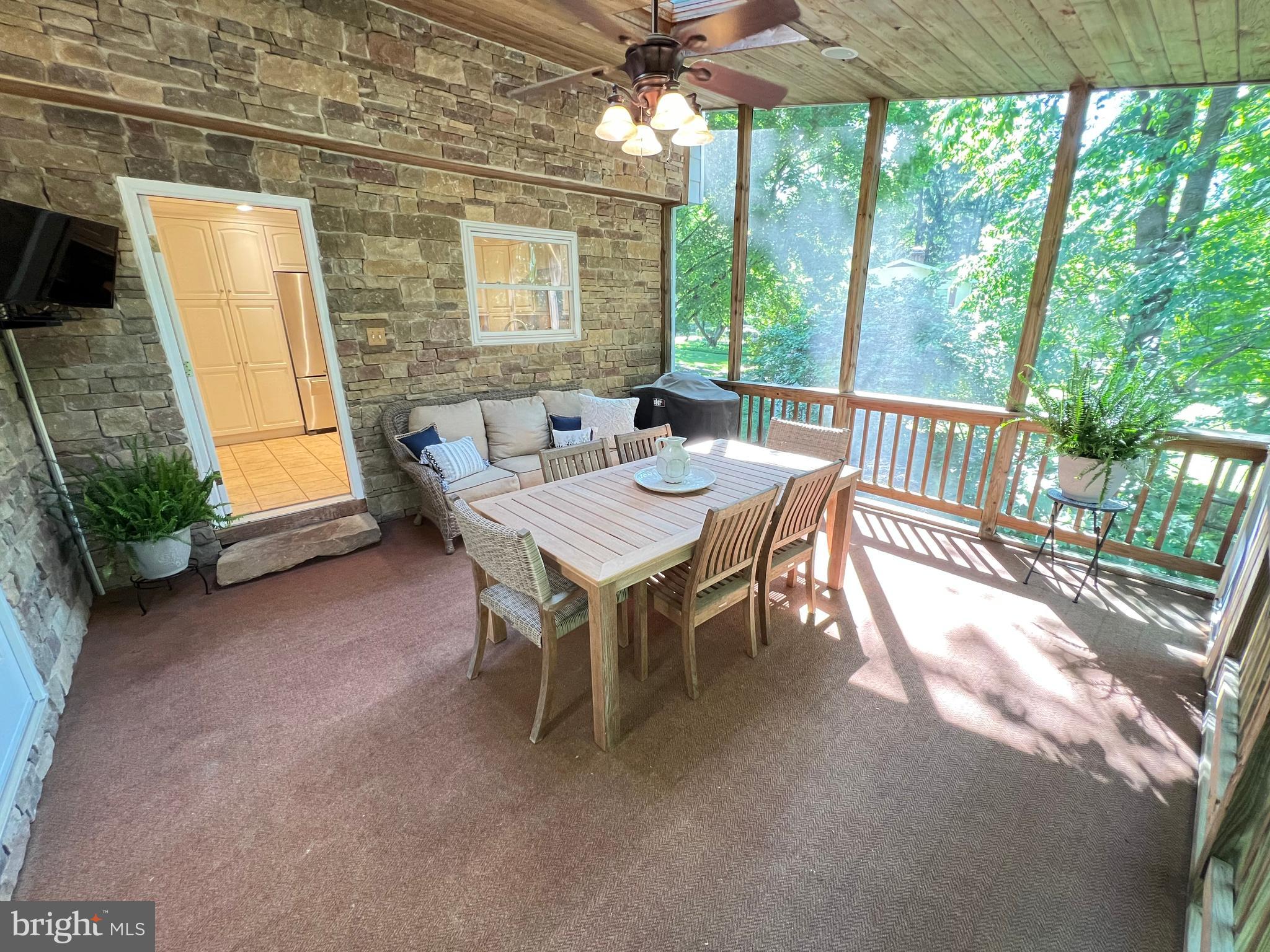 1027 Hart Road Baltimore, MD 21286 - Photo 16 of 94 a view of a patio with a table and chairs