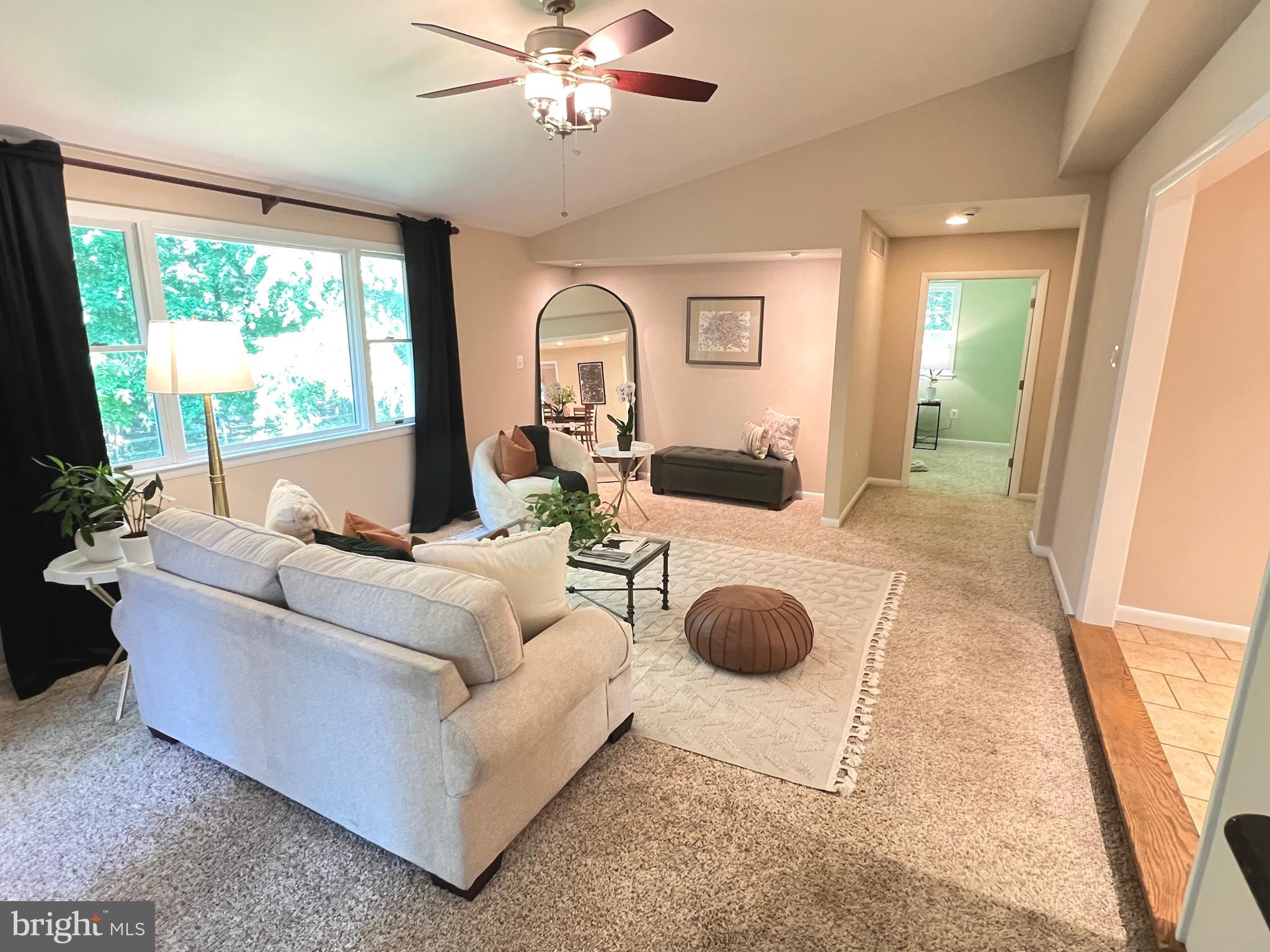 1027 Hart Road Baltimore, MD 21286 - Photo 18 of 94 a living room with furniture and a large window