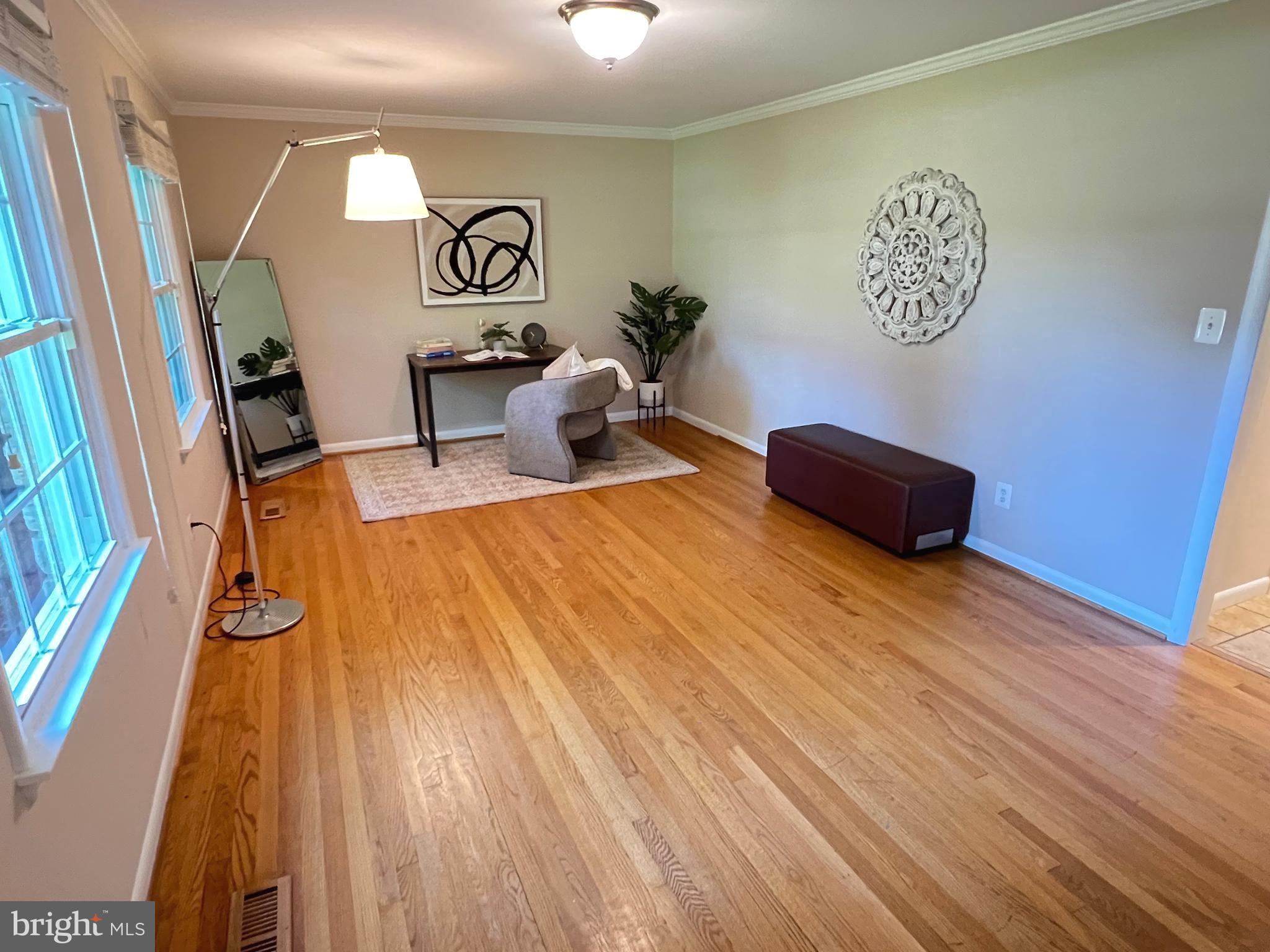 1027 Hart Road Baltimore, MD 21286 - Photo 26 of 94 a view of a room with furniture and wooden floor