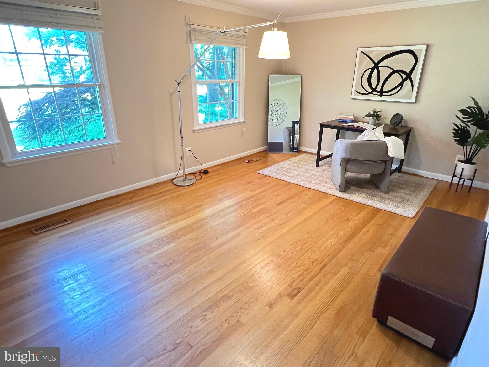 1027 Hart Road Baltimore, MD 21286 - Photo 27 of 94 a room with wooden floor and windows