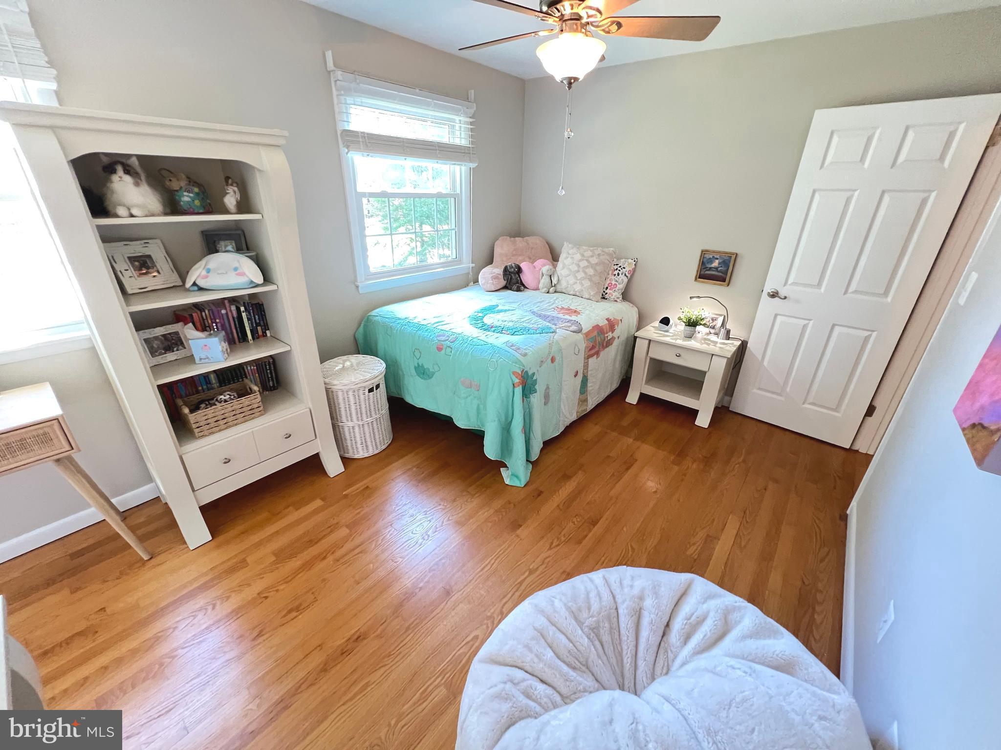1027 Hart Road Baltimore, MD 21286 - Photo 37 of 94 a bedroom with furniture and a wooden floor