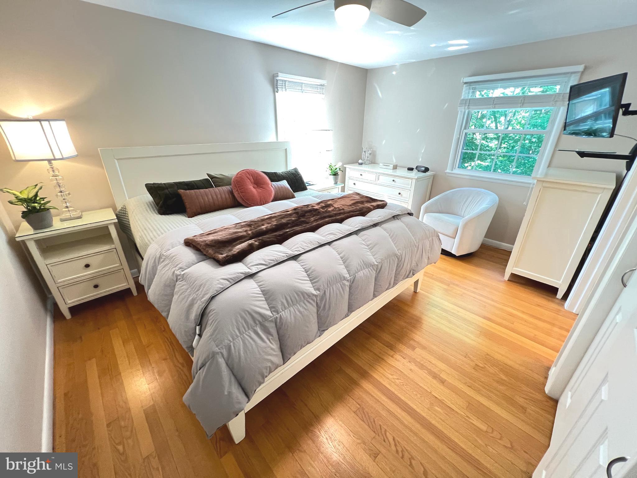 1027 Hart Road Baltimore, MD 21286 - Photo 42 of 94 a bedroom with a bed and wooden floor