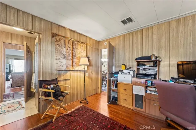 a living room with furniture a rug and a window