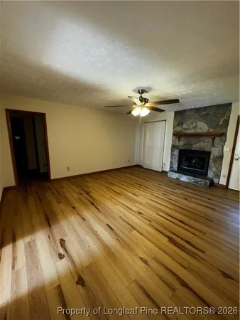 a view of a livingroom with wooden floor