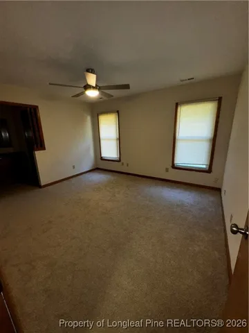 a view of a livingroom with a ceiling fan and a ceiling fan
