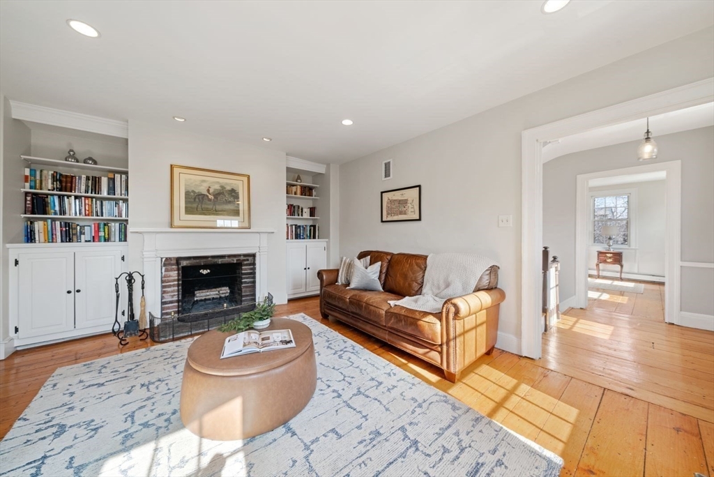 10 Summer Street, Unit 1 Boston, MA 02129 - Photo 14 of 37 a living room with furniture and a fireplace