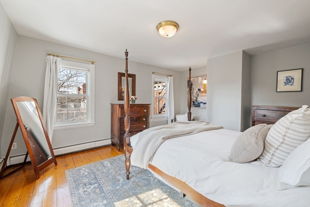 10 Summer Street, Unit 1 Boston, MA 02129 - Photo 20 of 37 a bed room with a bed and a window