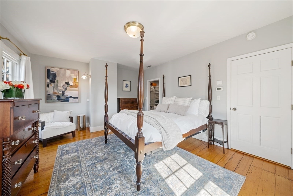 10 Summer Street, Unit 1 Boston, MA 02129 - Photo 21 of 37 a bed room with a bed and a chair