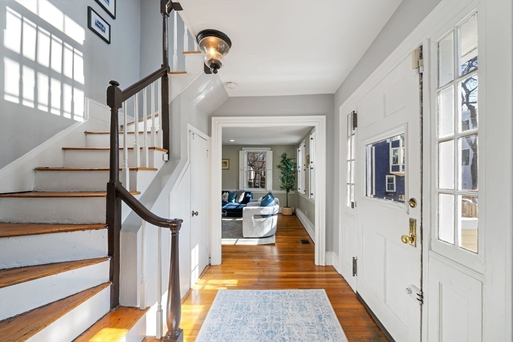 10 Summer Street, Unit 1 Boston, MA 02129 - Photo 6 of 37 a view of a hallway with wooden floor and staircase