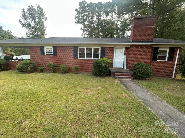 front view of a house with a yard