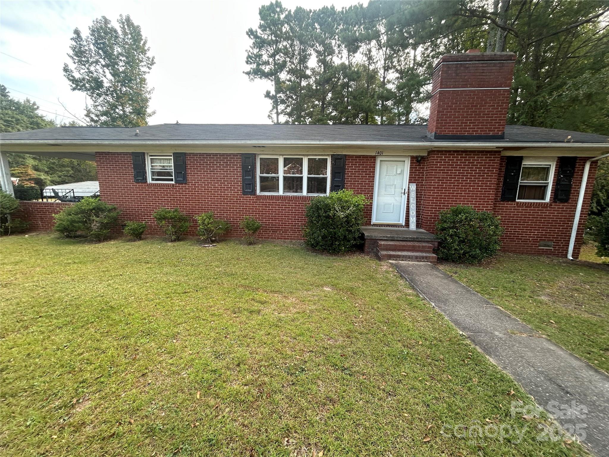 front view of a house with a yard