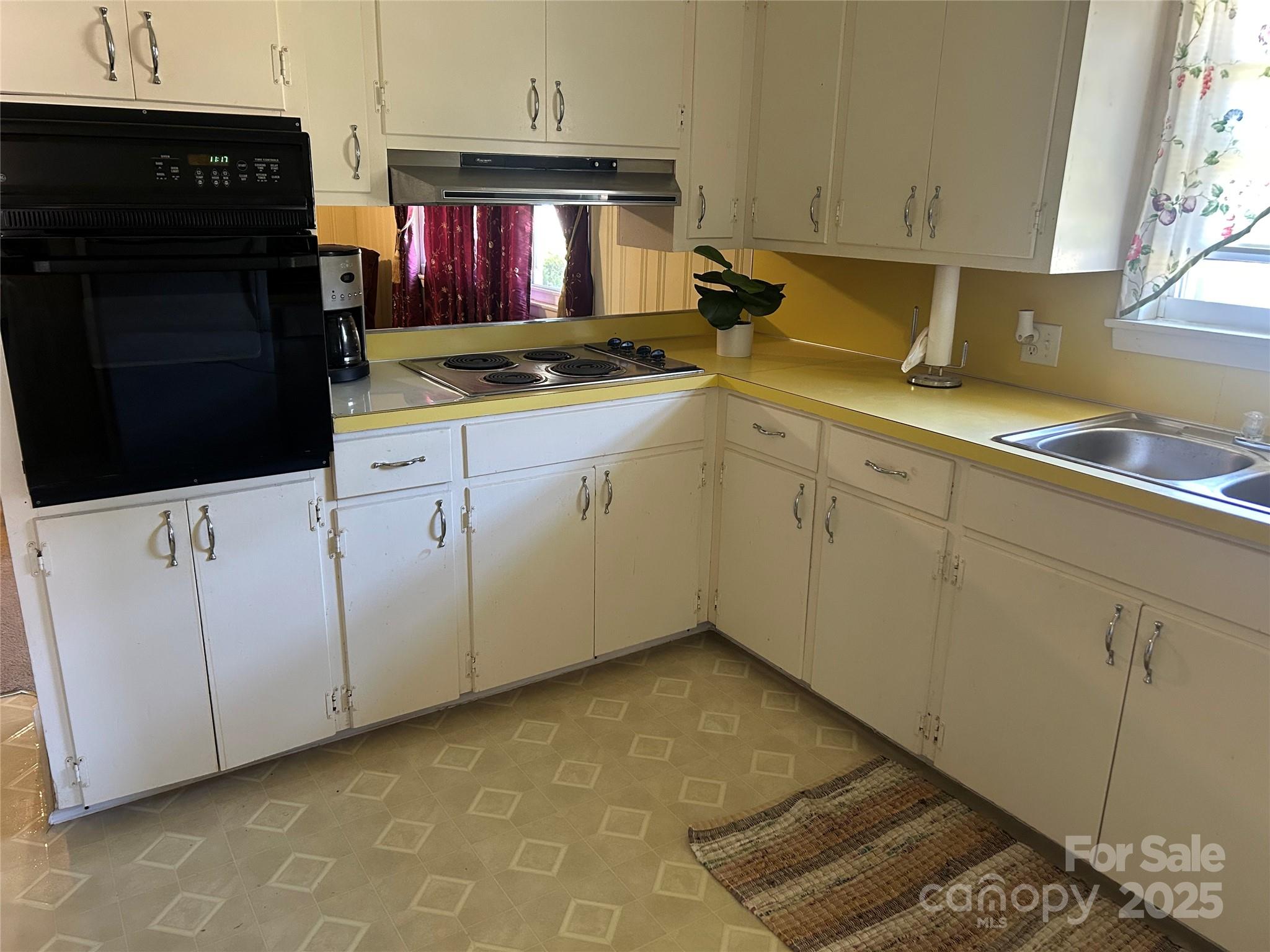 1401 Morven Road Wadesboro, NC 28170 - Photo 12 of 27 a kitchen with stainless steel appliances granite countertop a sink stove and cabinets