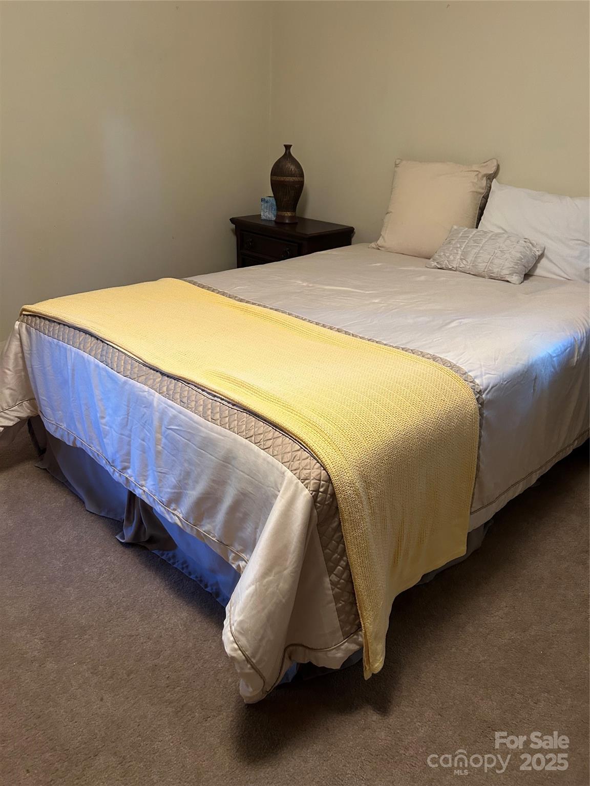 1401 Morven Road Wadesboro, NC 28170 - Photo 14 of 27 a bedroom with a bed and a wall painting