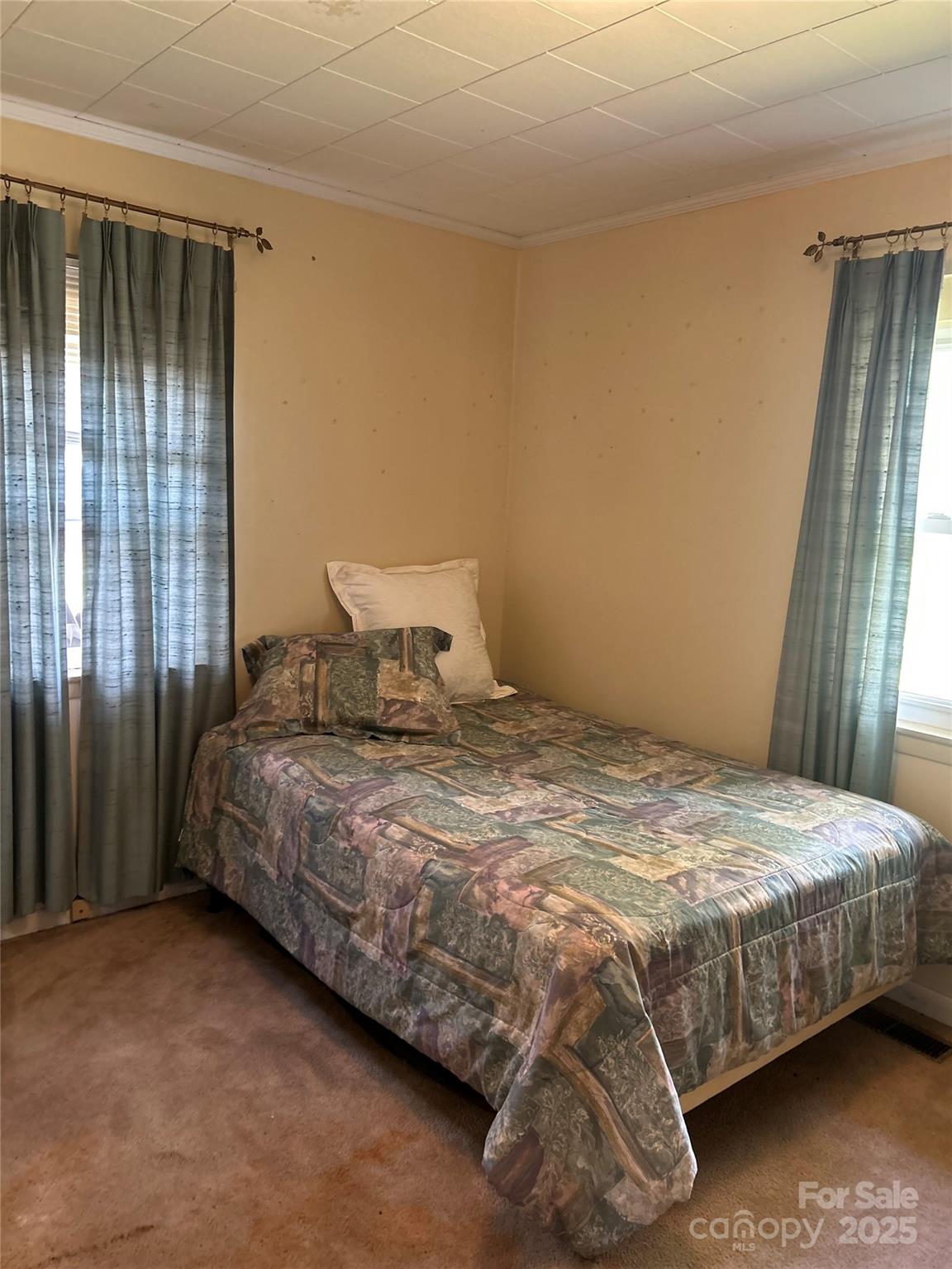 1401 Morven Road Wadesboro, NC 28170 - Photo 16 of 27 a bedroom with a bed and a window