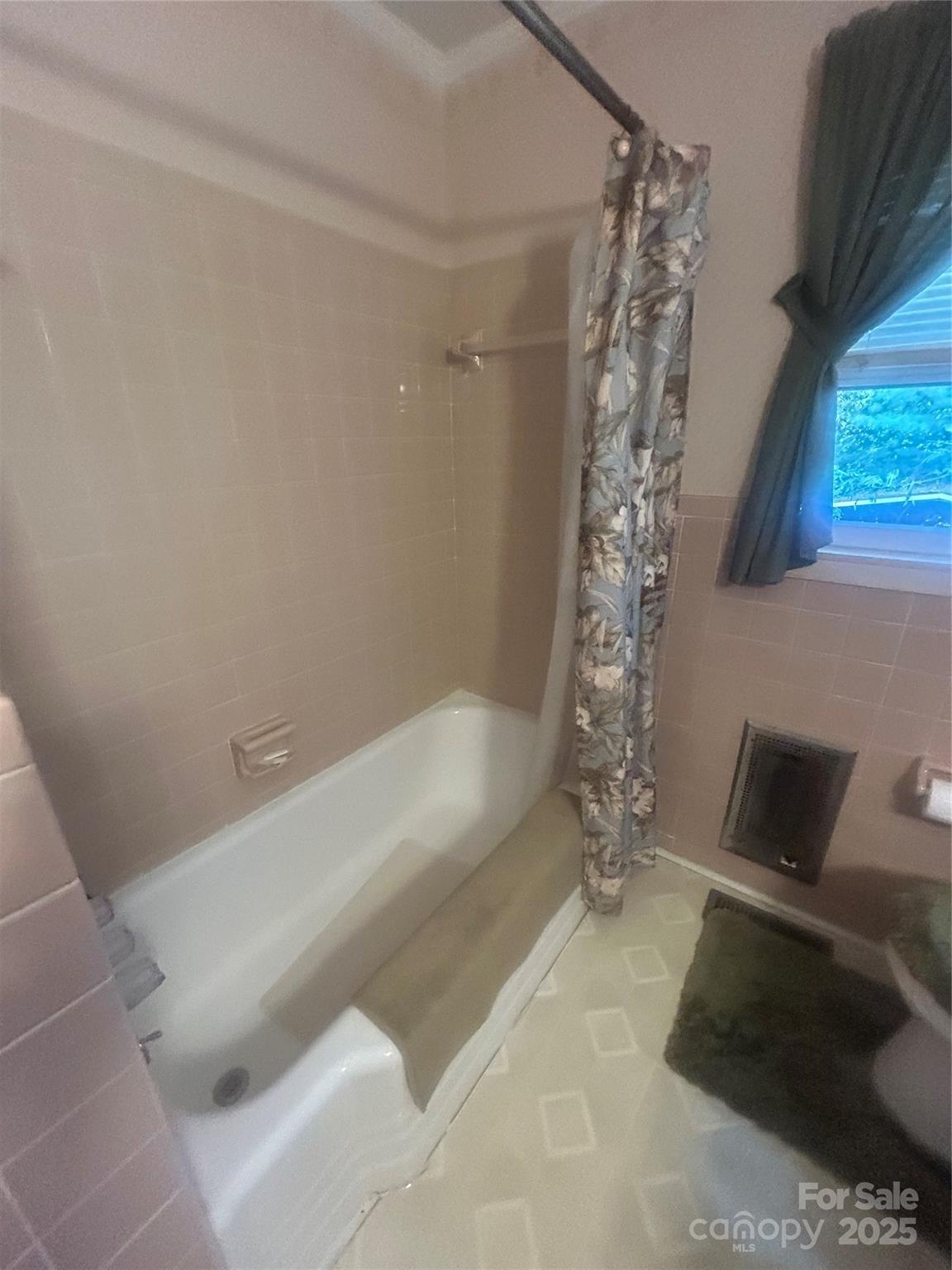 1401 Morven Road Wadesboro, NC 28170 - Photo 20 of 27 a bathroom with a bathtub and shower