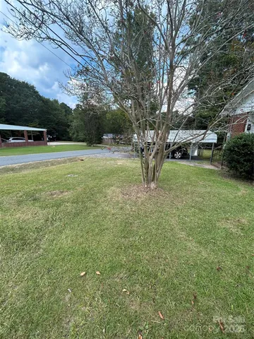 a view of backyard with green space