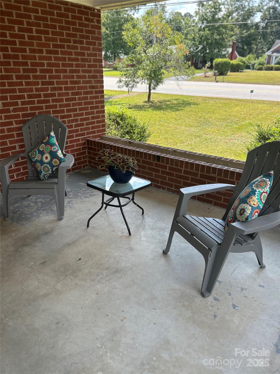 1401 Morven Road Wadesboro, NC 28170 - Photo 25 of 27 a view of a terrace with chairs and a table