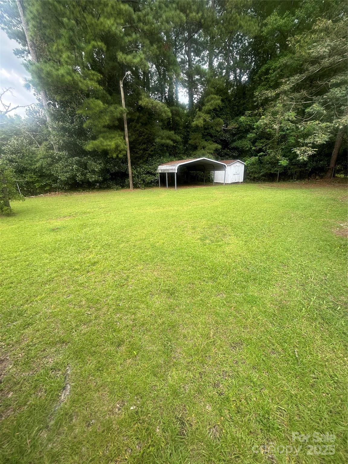 1401 Morven Road Wadesboro, NC 28170 - Photo 26 of 27 a view of a house with a yard