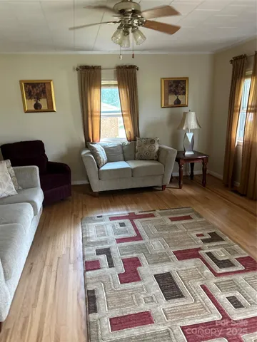 a living room with furniture and a rug