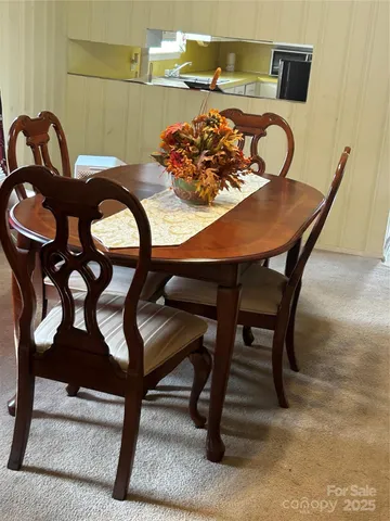 a table room with a table and chairs