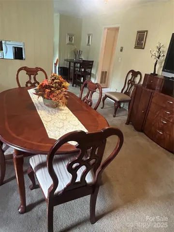 a dinning room with furniture