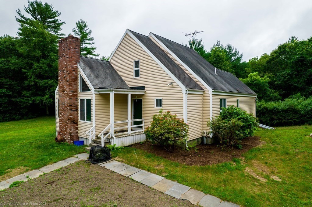 30 Wordell Street Rochester, MA 02770 - Photo 1 of 31 a view of a house with a yard plants and a large tree