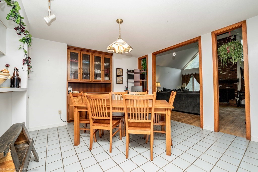 30 Wordell Street Rochester, MA 02770 - Photo 18 of 31 a dining room with furniture a chandelier and window