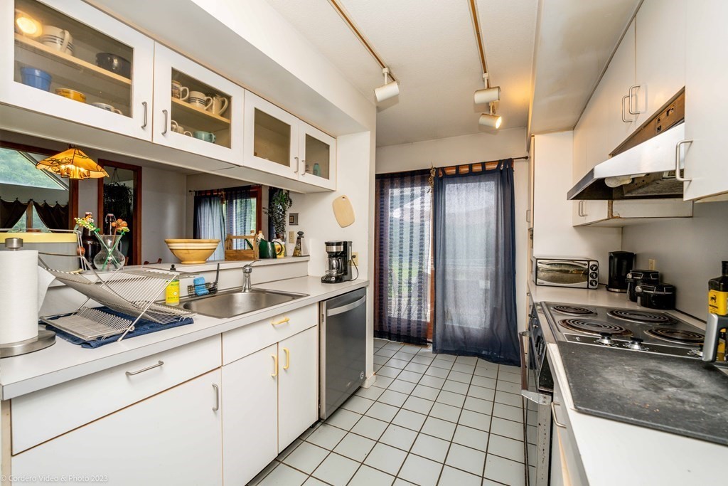 30 Wordell Street Rochester, MA 02770 - Photo 20 of 31 a kitchen with stainless steel appliances granite countertop a refrigerator a stove and a sink