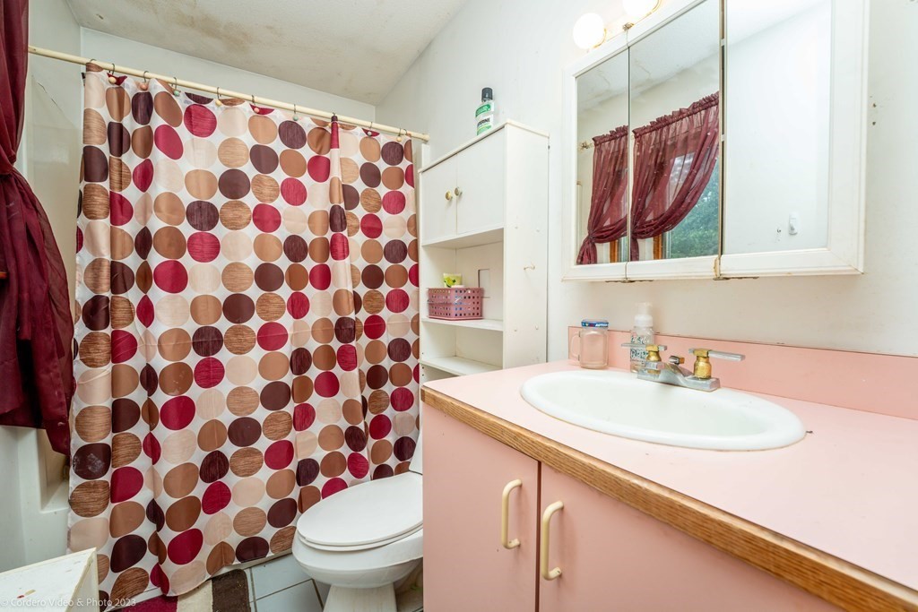 30 Wordell Street Rochester, MA 02770 - Photo 25 of 31 a bathroom with a sink and a mirror