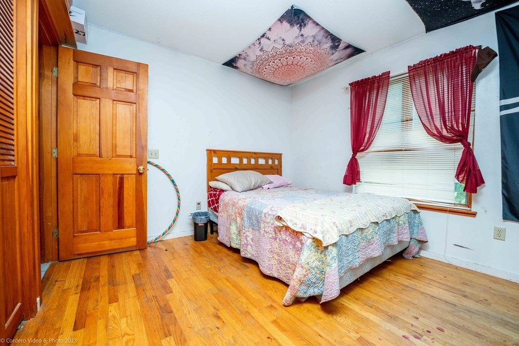 30 Wordell Street Rochester, MA 02770 - Photo 27 of 31 a bedroom with a bed and a painting on the wall