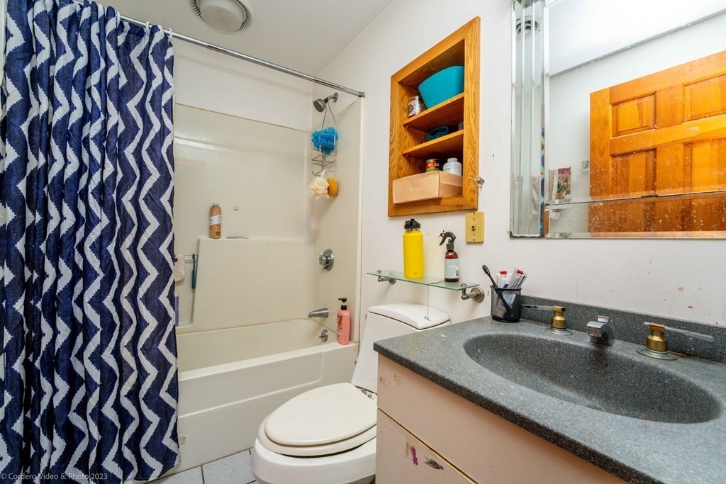 30 Wordell Street Rochester, MA 02770 - Photo 28 of 31 a bathroom with a granite countertop sink a toilet and shower