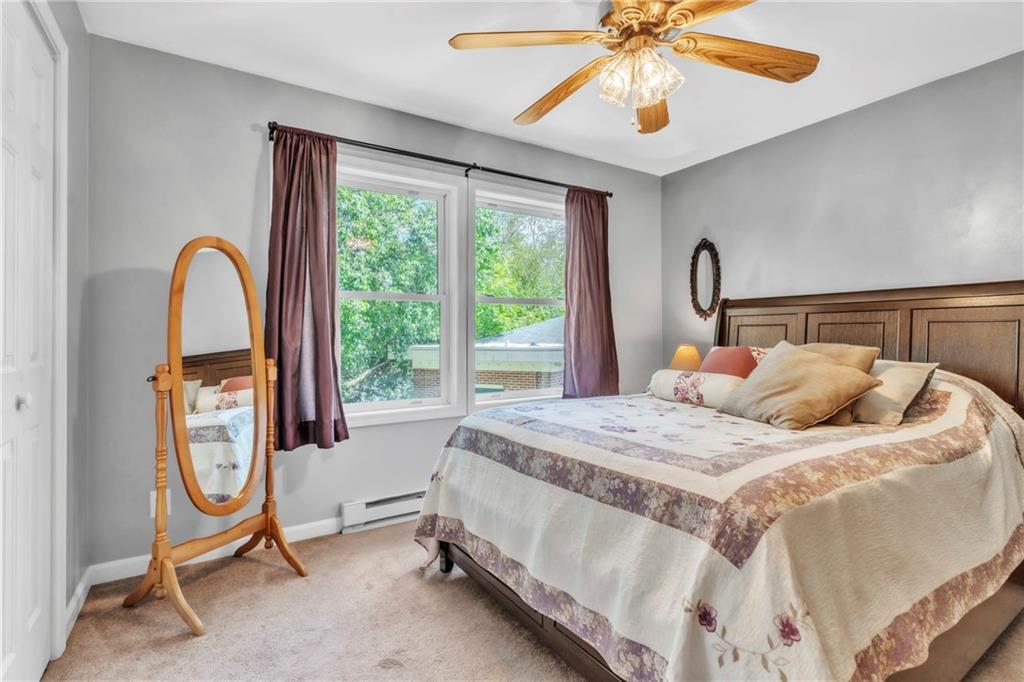 120 West Catherine Street Somerset, PA 15501 - Photo 14 of 31 a bedroom with a bed a chandelier and a window