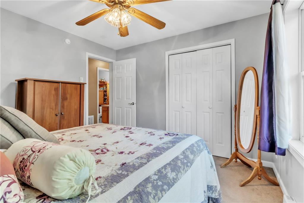 120 West Catherine Street Somerset, PA 15501 - Photo 15 of 31 a bedroom with a bed and a chandelier