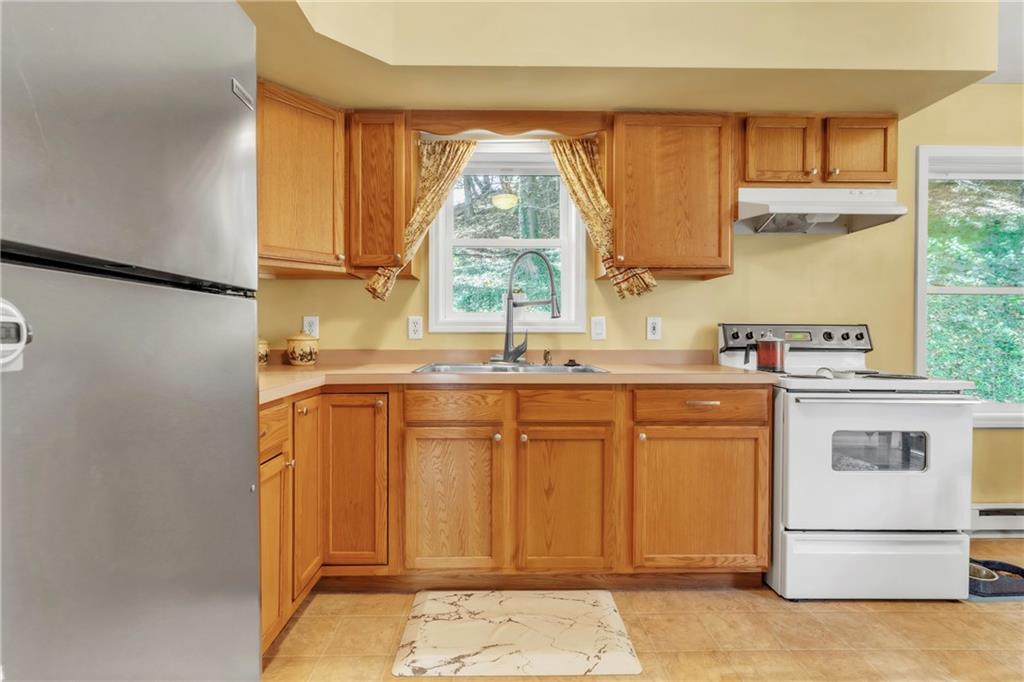 120 West Catherine Street Somerset, PA 15501 - Photo 6 of 31 a kitchen with stainless steel appliances granite countertop a sink window and cabinets