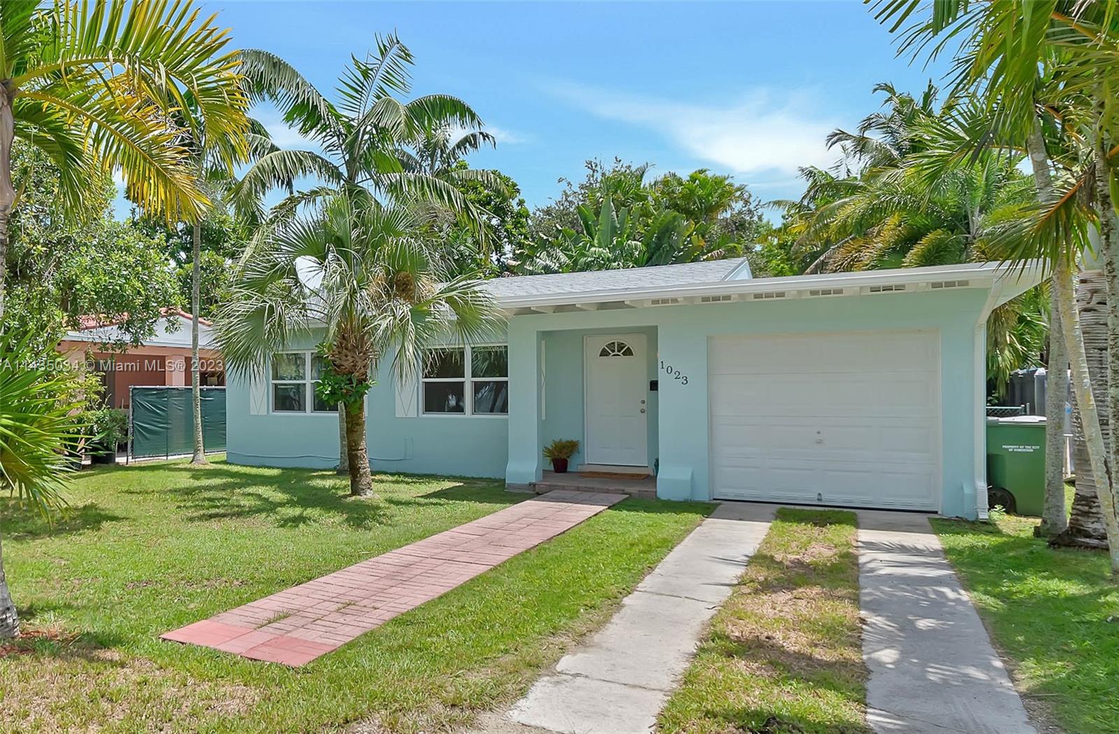1023 Northwest 3rd Avenue Homestead, FL 33030 - Photo 1 of 32 a front view of a house with a yard