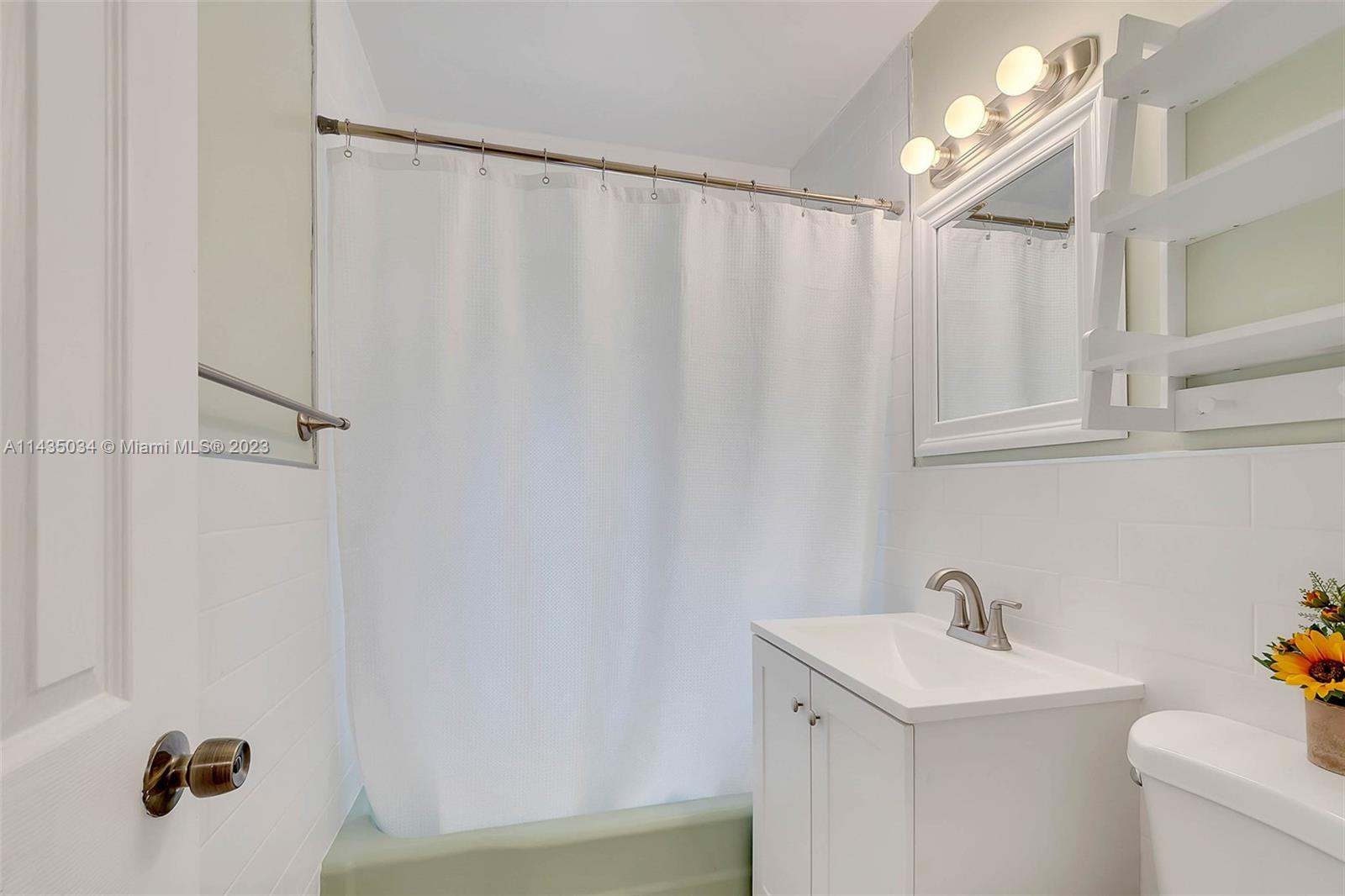 1023 Northwest 3rd Avenue Homestead, FL 33030 - Photo 15 of 32 a bathroom with a sink and a mirror